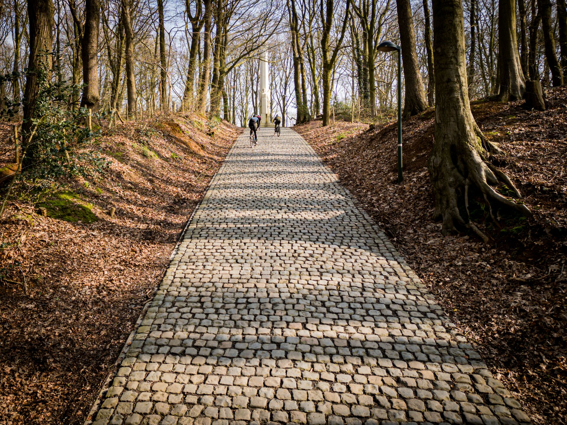 Known for it’s flat finish, Gent-Wevelgem has earned a name for being one of the most gruelling races for sprinters. This signposted route however, doesn't finish in Wevelgem and neither does it start in Gent. The 84 km loop starts and finishes at the foot of the legendary Kemmelberg in Heuvelland, Flanders. With its 883 altimeters, the route focusses on the area of the West Flemish Hills along the French-Belgian border. Expect difficult terrain, complete with cobbles, plugstreets, hills and unfavourable winds. Resolute in its history, the Gent-Wevelgem navigates a number of the battlefields from the First World War. We asked our friends at Cycling Destination and Fat Pigeon to ride the route. cycling route Gent - Wevelgem (20)