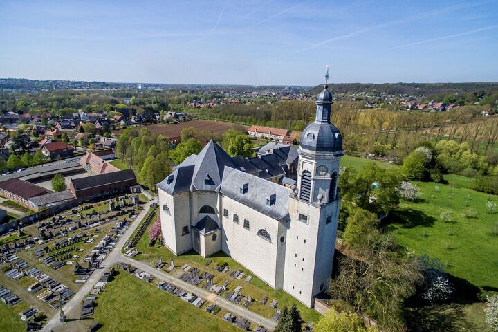 Leuven is a city east of Brussels, Belgium, known for its breweries. On a central square is the 15th-century town hall, with its tall spires. The building is decorated with hundreds of statues of local figures, biblical characters and saints. Opposite, the late Gothic St. Peter’s Church houses a “Last Supper” by the Flemish Primitive painter Dieric Bouts. Nearby, Oude Markt is a long square lined with bars and cafes. Leuven Abdij van Vlierbeek