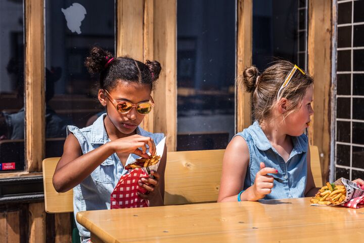 Eating belgian fries © Piet De Kersgieter