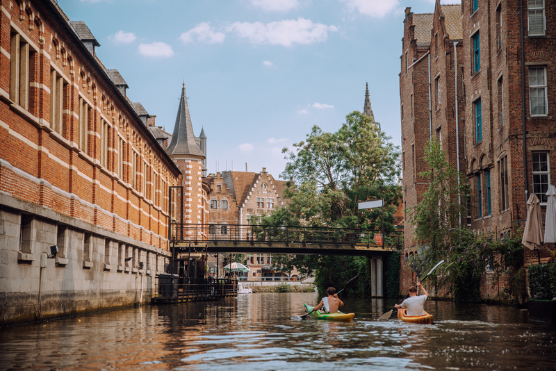 Kayakers on the Leie in Ghent. Two kayakers on the Leie in Ghent.