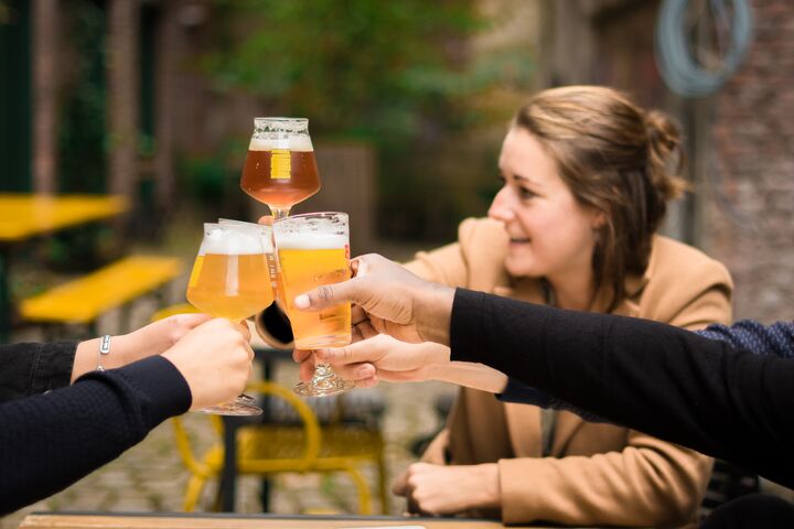 Friends drinking beer on a terrace - cheers (3)